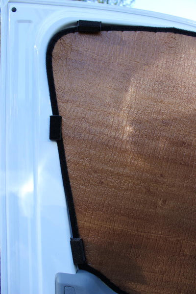 Magnet kit holding up dark woodgrain insulation panel